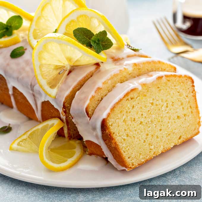 14 Romantic Valentine's Day Recipes to Make at Home 12 Lemon loaf drizzled with lemon glaze on a white plate