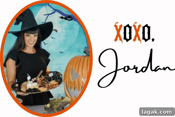 Jordan from Jordan's Easy Enteraining holding a Halloween charcuterie board