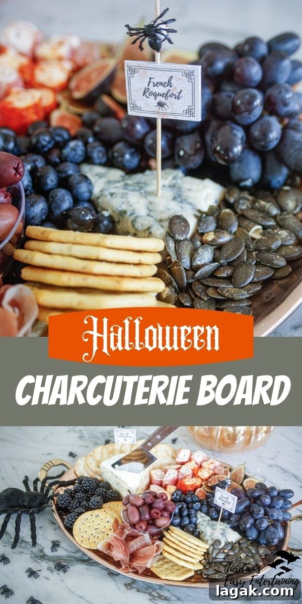 a Halloween charcuterie board with cheese, meat, crackers, fruit, and olives and styled with a spooky spider