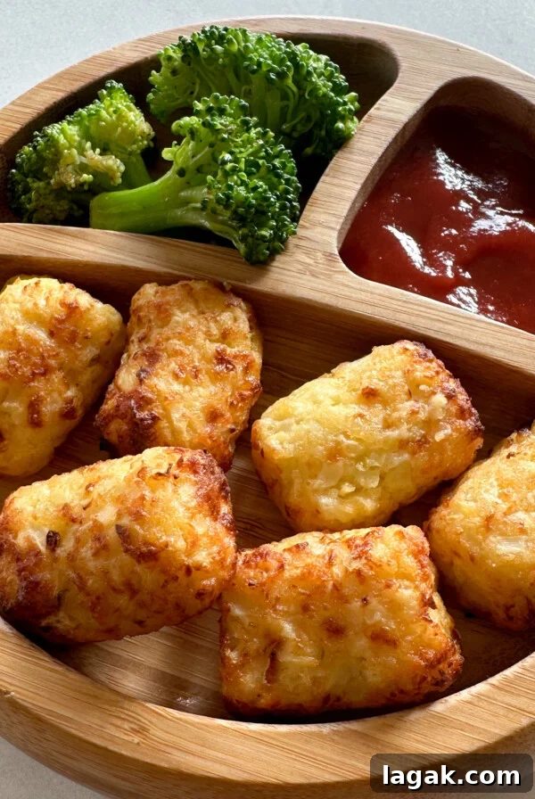 Crispy Chicken Nuggets with Veggie Dip and Hidden Veggies 11 Air fryer cauliflower tots served with broccoli and ketchup.