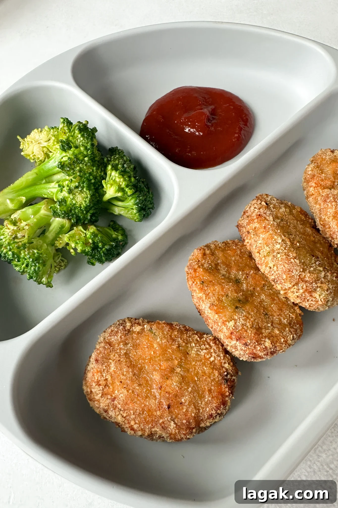 Crispy Chicken Nuggets with Veggie Dip and Hidden Veggies 6 Veggie chicken nuggets served with broccoli and ketchup.
