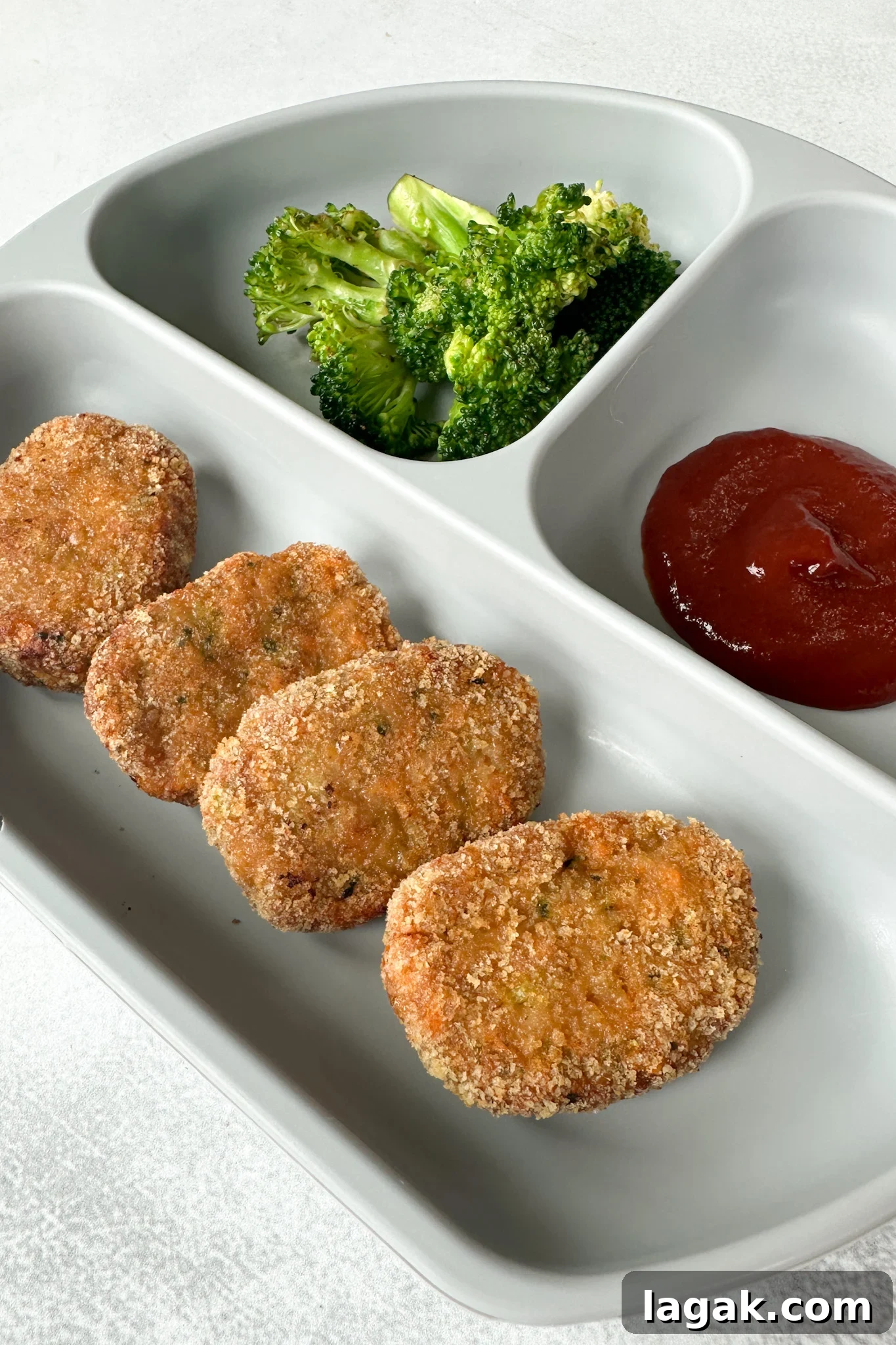 Crispy Chicken Nuggets with Veggie Dip and Hidden Veggies 8 Veggie chicken nuggets served with broccoli and ketchup.