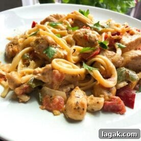 Fiesta Chicken Pasta Recipe: Zesty One-Pot Dinner Ideas 3 Fiesta chicken pasta on a white plate with bell peppers.