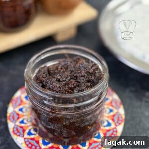 Tangy South Indian Ginger Pickle (Inji Thokku) Recipe 2 Traditional ginger pickle in a glass jar, perfect for Indian cuisine.