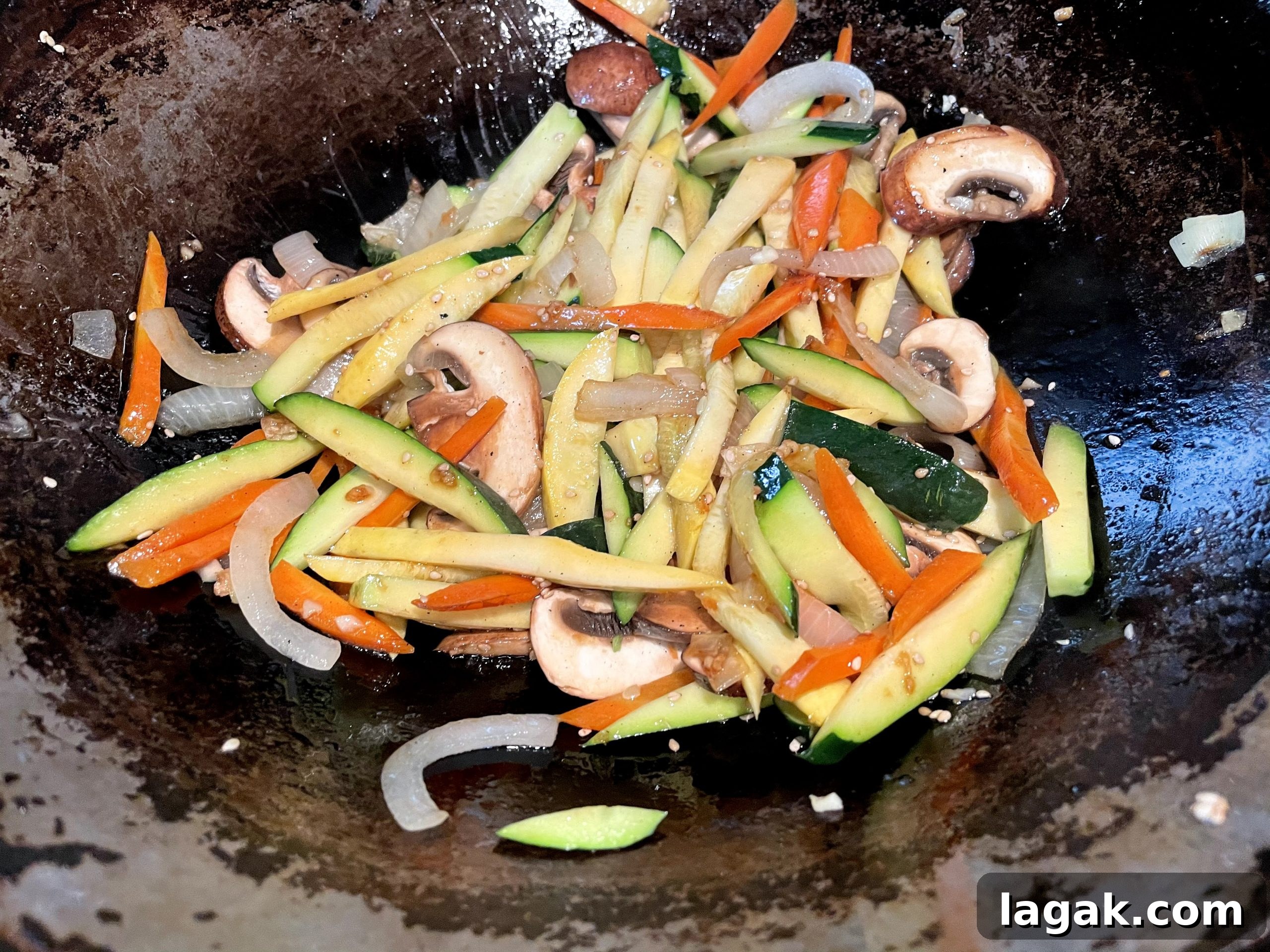 Stir fry vegetables before adding cooked japchae noodles Stir fry vegetables before adding cooked japchae noodles