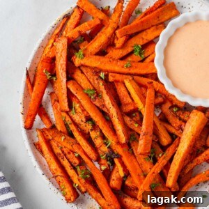 Crispy Air Fryer Carrot Fries Recipe for a Crunchy Snack 11 air fryer carrot fries on a plate with dip.