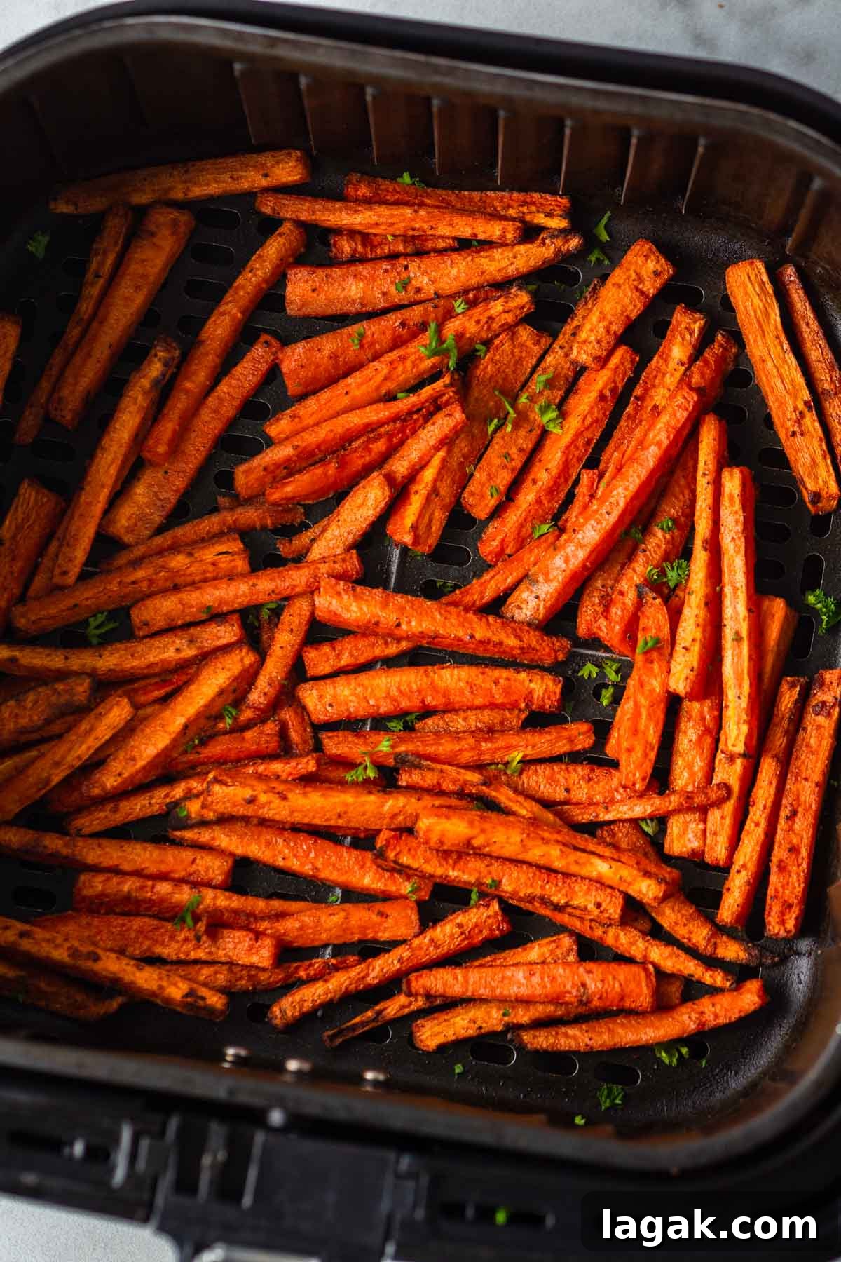 Crispy Air Fryer Carrot Fries Recipe for a Crunchy Snack 8 air fried carrot fries in the air fryer basket.