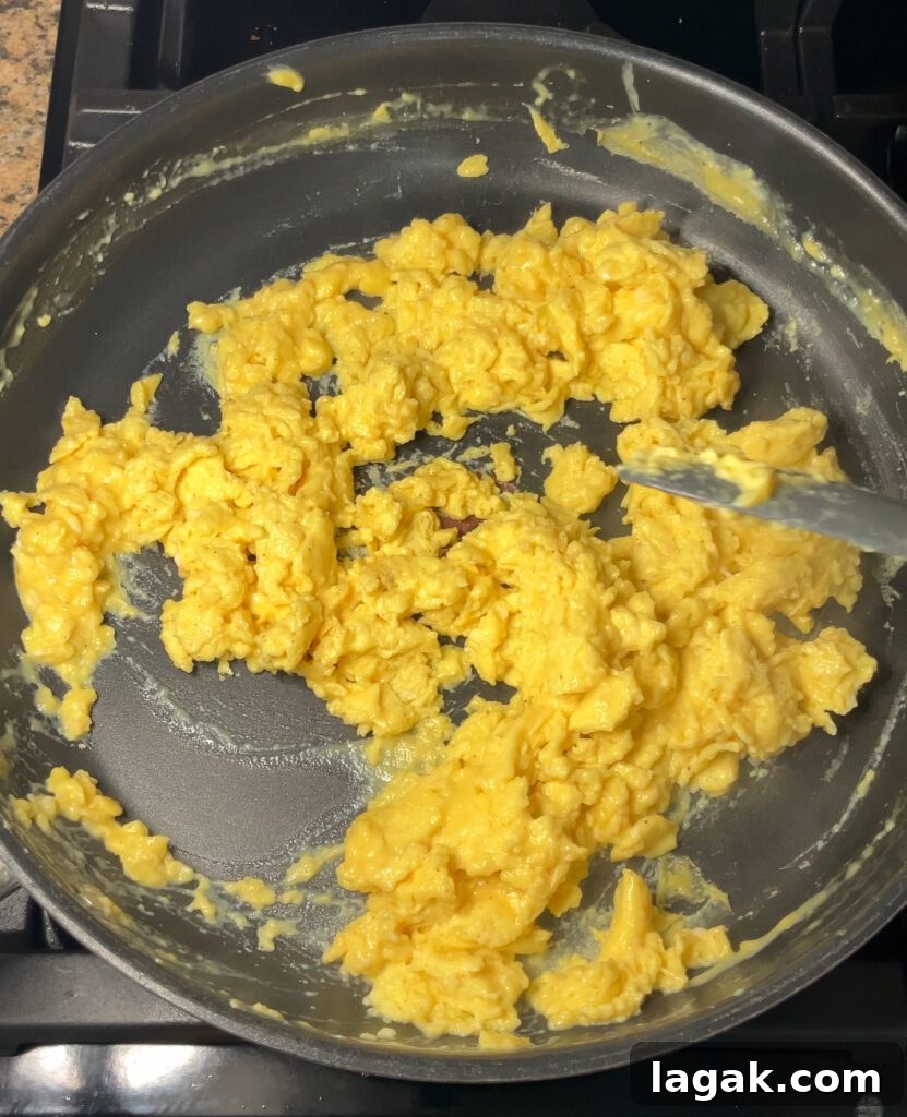 Smothered Breakfast Burritos: Fully Loaded Morning Burrito Recipe 17 scrambled eggs