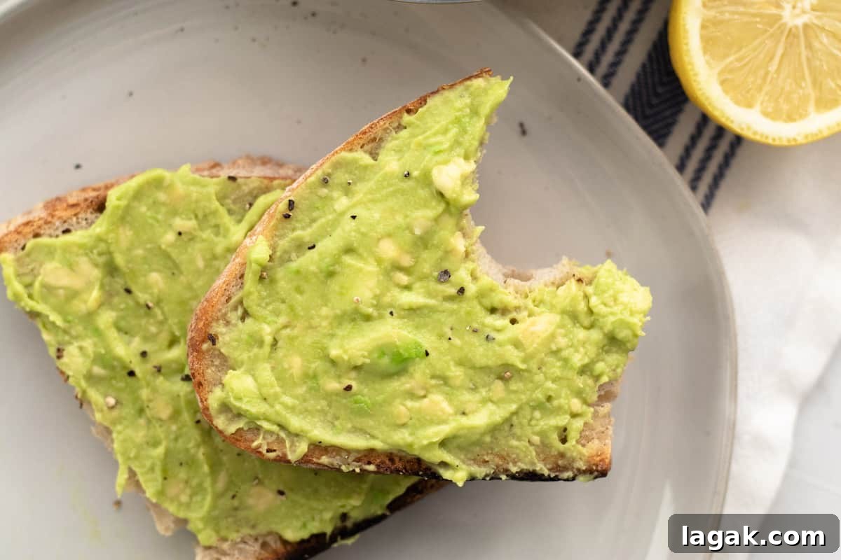 3-Ingredient Dunkin’ Style Avocado Toast Recipe 9 avocado toast with a bite taken out of it