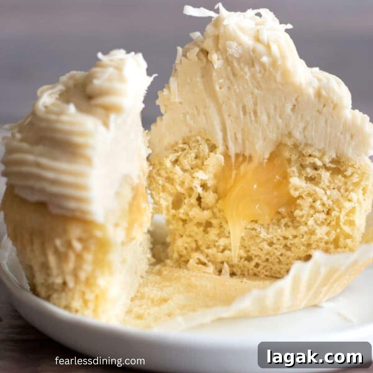Gluten-Free Lemon Curd Cupcakes with Silky Citrus Filling 9 A closeup of the cupcake cut in half so you can see the lemon curd filling.