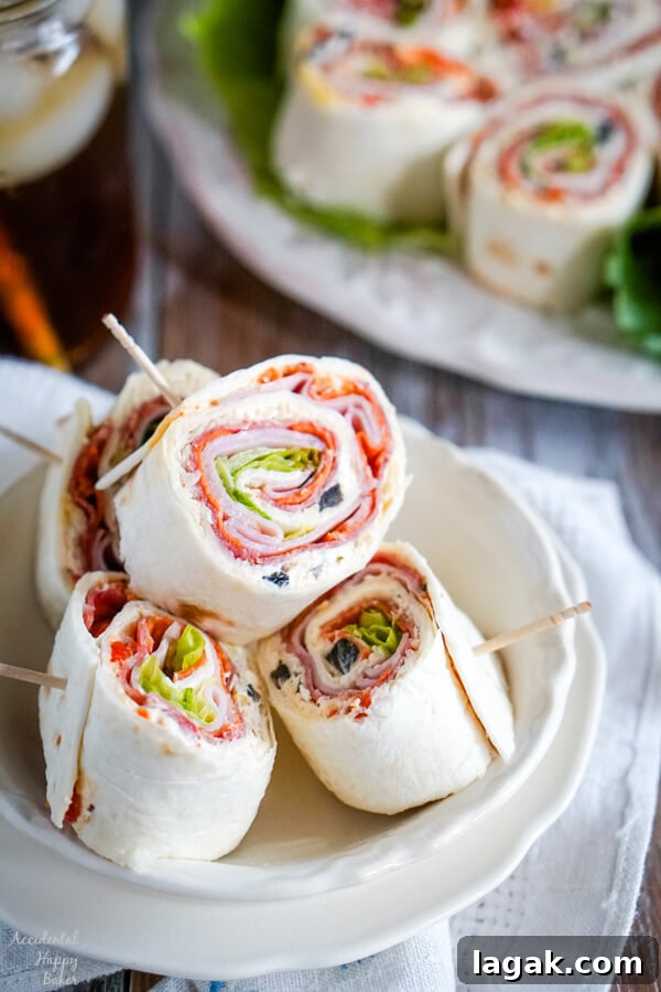 Italian Pinwheel Appetizers: Savory Tortilla Roll-Ups Recipe 2 A white bowl with several Italian Pinwheels stacked inside.