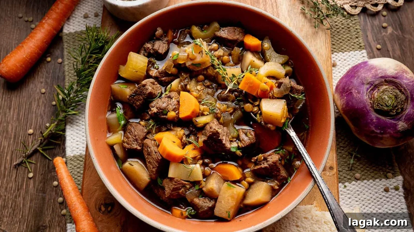 21 Slow Cooker Dinners for Stress-Free Weeknight Meals 10 Beef stew with lentils, turnips, and carrots slow-cooked to tenderness in a rustic bowl.