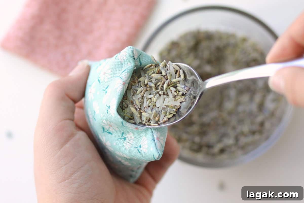Make Lavender Sachets: A Beginner-Friendly Sewing Project 6 dried lavender and rice being spooned into a handmade sachet