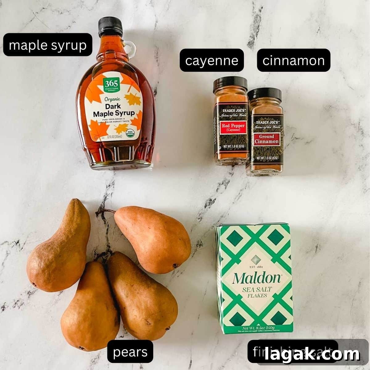 Air Fryer Cinnamon Pears Recipe 3 The labeled ingredients for air fryer pears sit on a white marble counter.