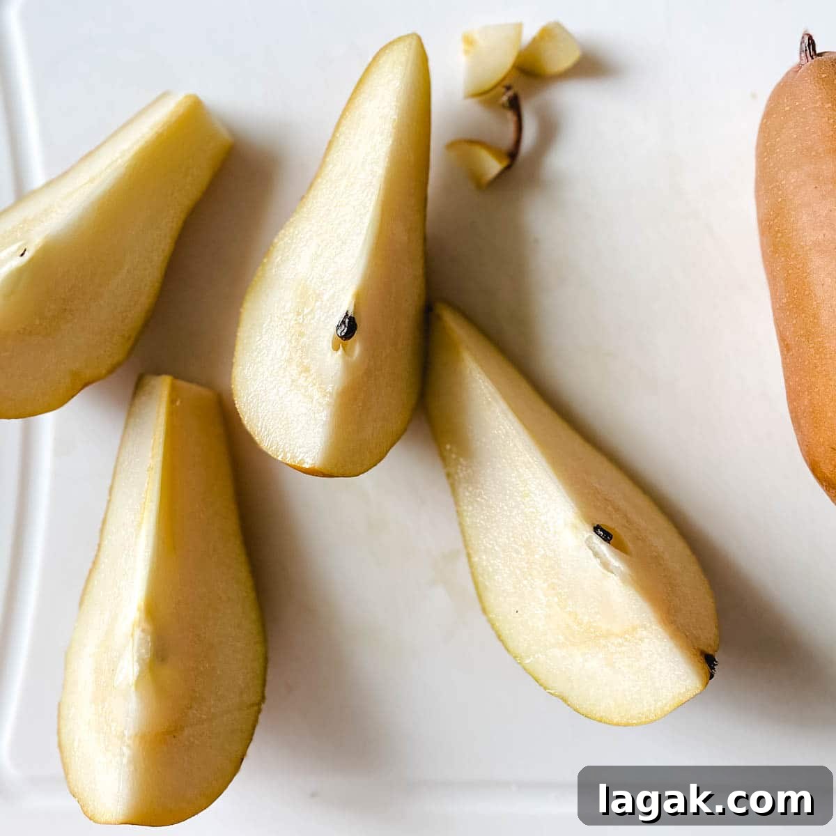 Air Fryer Cinnamon Pears Recipe 5 Pears are sliced into wedges.