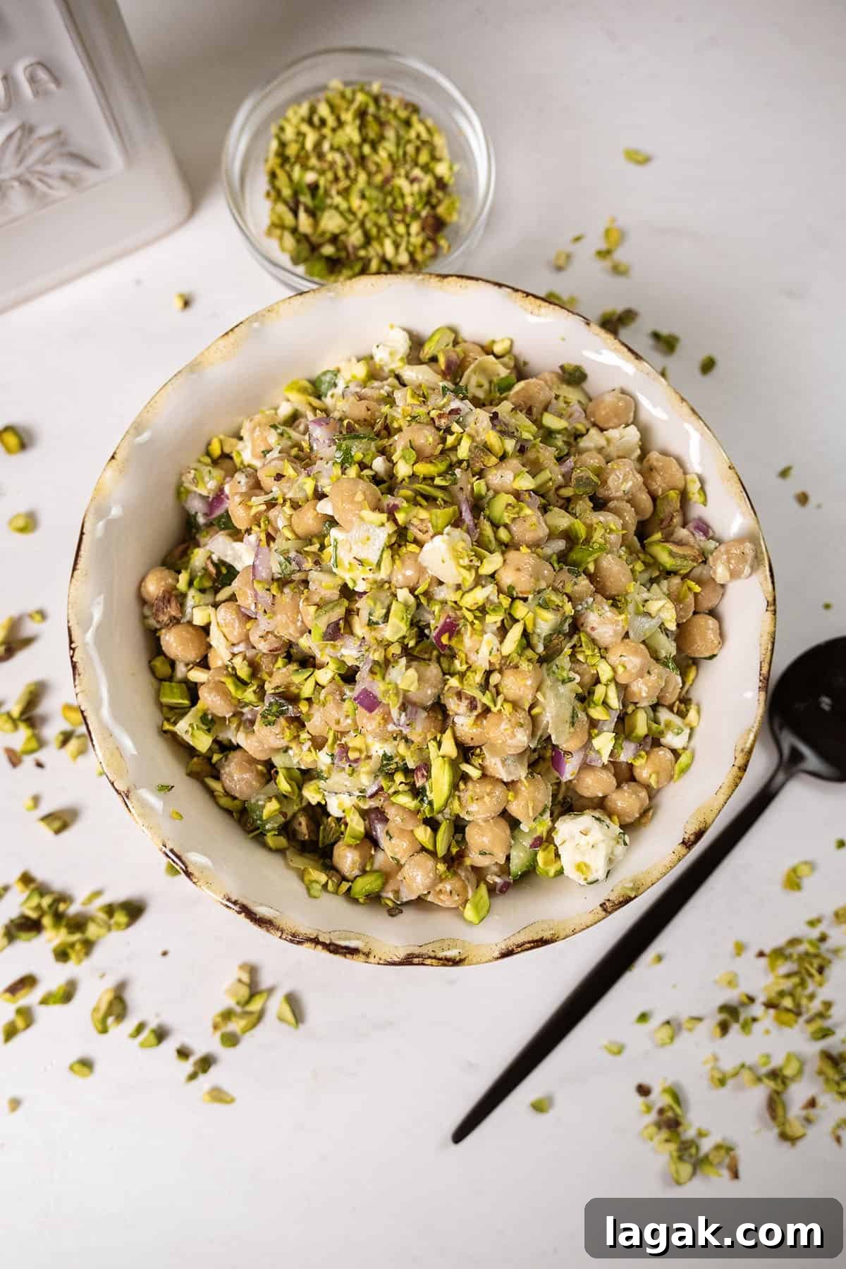 Mediterranean Chickpea, Cucumber & Feta Salad Recipe 6 Chickpea salad with cucumbers in a bowl.