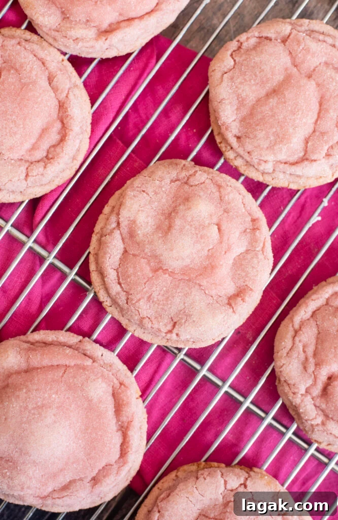 Strawberry Crinkle Cookies Recipe — Soft Pink Cookies for Spring 3 Soft, chewy pink strawberry crinkle cookies made with real homemade strawberry syrup. Perfect homemade Valentine’s Day treat or dessert for gifting and parties.