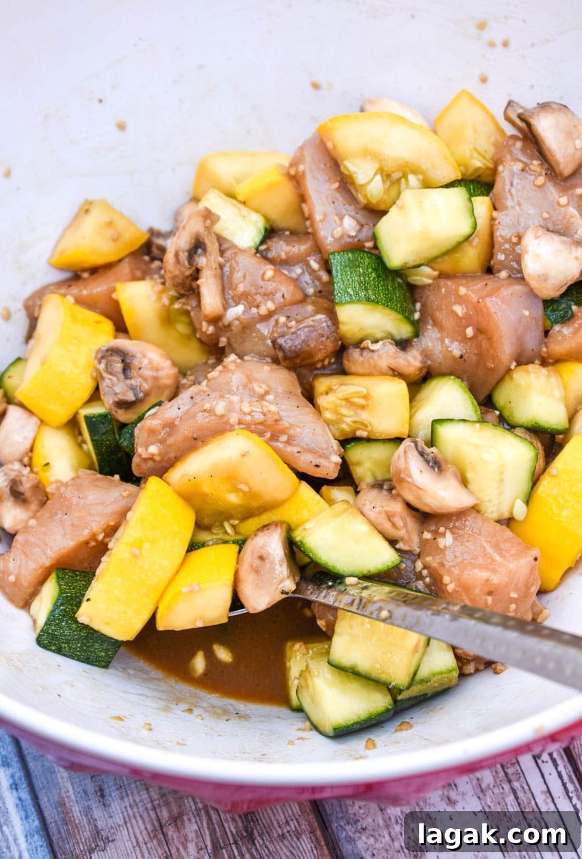 air fryer hibachi chicken and vegetables ingredients in a large mixing bowl