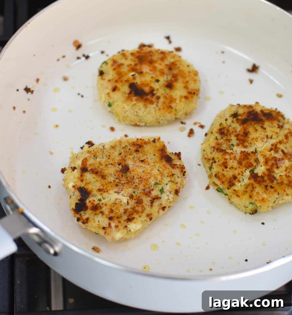 Mediterranean Salmon Cakes recipe in a skillet 