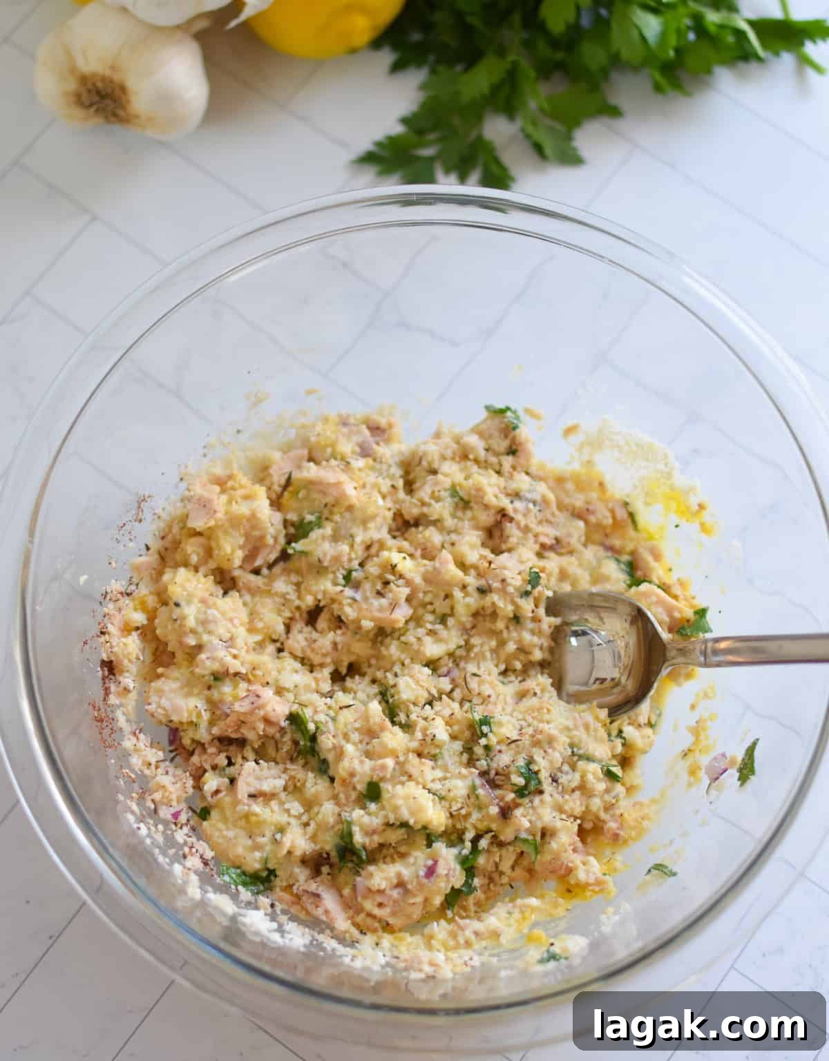Salmon Patties recipe recipe ingredients mixed in a clear bowl