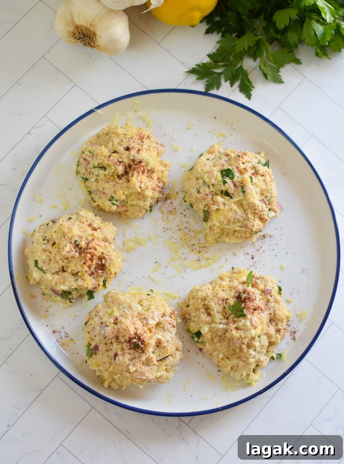 Mediterranean Salmon Patties formed on a plate 