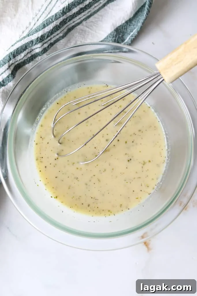 Garlic Parmesan Dressing Recipe for Salads and Veggies 5 Garlic parmesan dressing in a bowl.