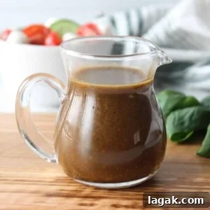 Garlic Parmesan Dressing Recipe for Salads and Veggies 7 Basil balsamic vinaigrette in a glass salad dressing container.