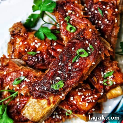 Instant Pot Asian Sticky Pork Ribs on a white plate.