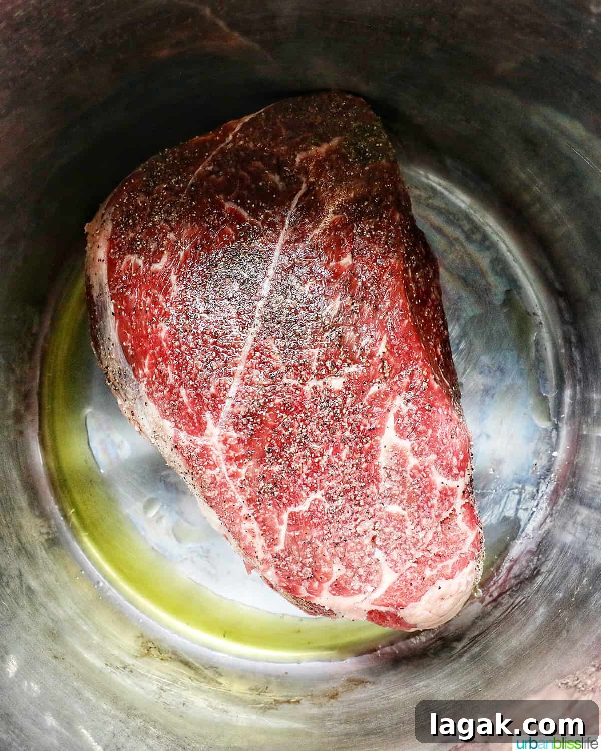 Tender Instant Pot Sirloin Tip Roast Recipe for Juicy Results 7 seasoned sirloin beef roast in the Instant Pot with olive oil, searing.