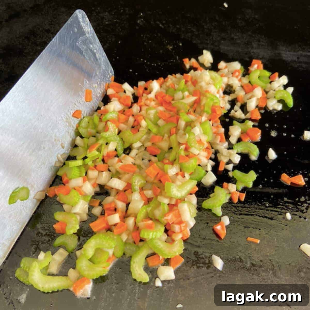 Crispy Blackstone Fried Rice Recipe for Restaurant-Style Flavor 4 Vegetables cooking on griddle.