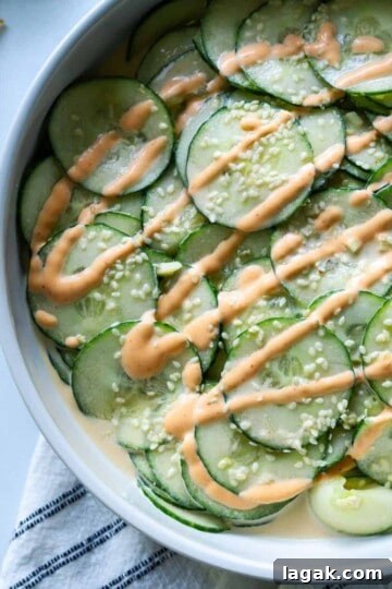 spicy cucumber salad topped with sriracha mayo