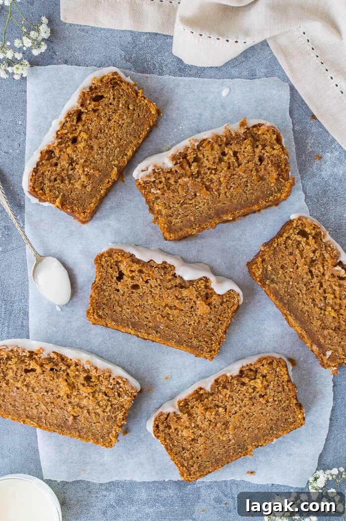 Moist Vegan Carrot Cake Loaf Recipe for Every Occasion 9 Slices of eggless carrot cake on baking parchment.