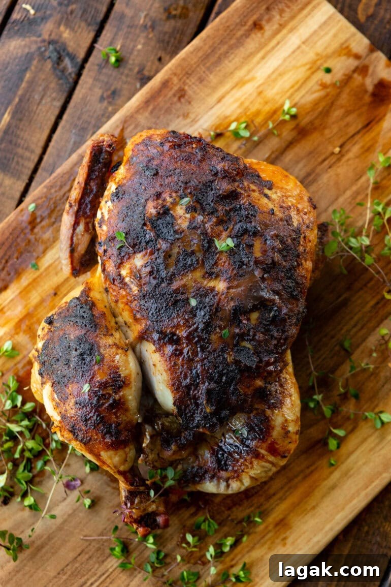 Crispy Air Fryer Whole Chicken Recipe (+ Step-by-Step Video) 5 airfried whole chicken with fresh thyme
