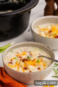 Slow Cooker Potato Soup served with bacon and chives toppings