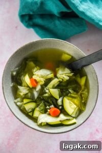 gray bowl filled with miso soup with veggies