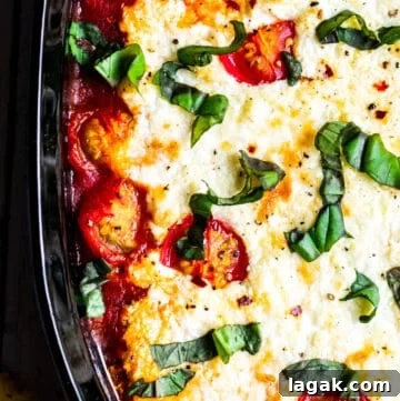 Overhead shot of goat cheese dip in black baking dish.