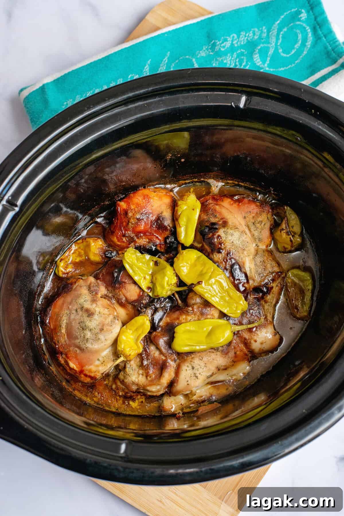 Mississippi Chicken Served Over Creamy Mashed Sweet Potatoes 8 Fully cooked Mississippi chicken in a slow cooker, tender and juicy with golden brown edges, topped with softened pepperoncini peppers and simmering in a rich, flavorful broth.