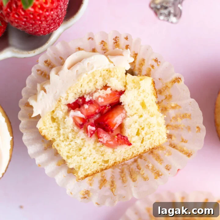 Inside look at a strawberry filled cupcakes.