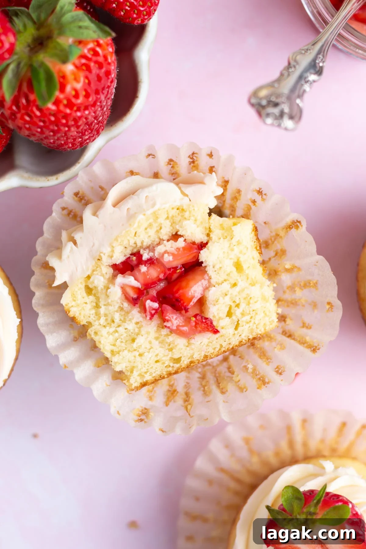 The inside of a strawberry filled cupcake.