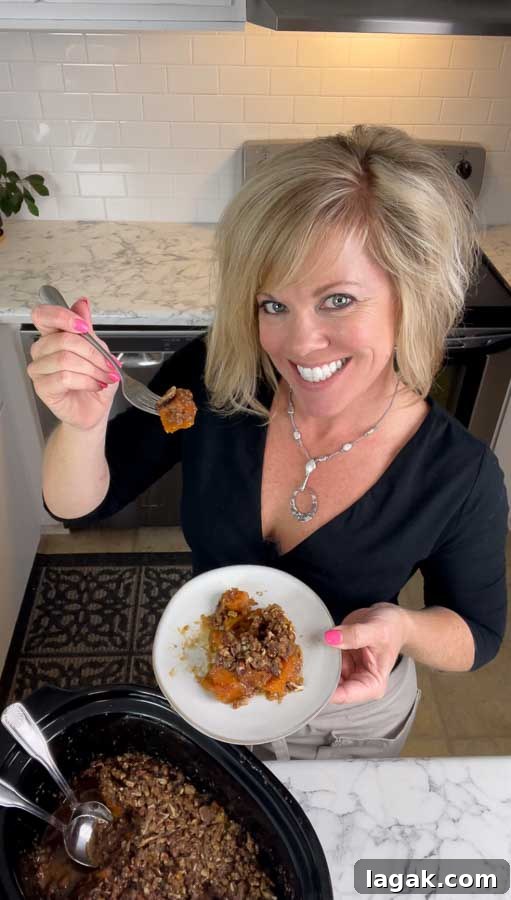 Jennifer trying a bite of Slow Cooker Sweet Potato Casserole