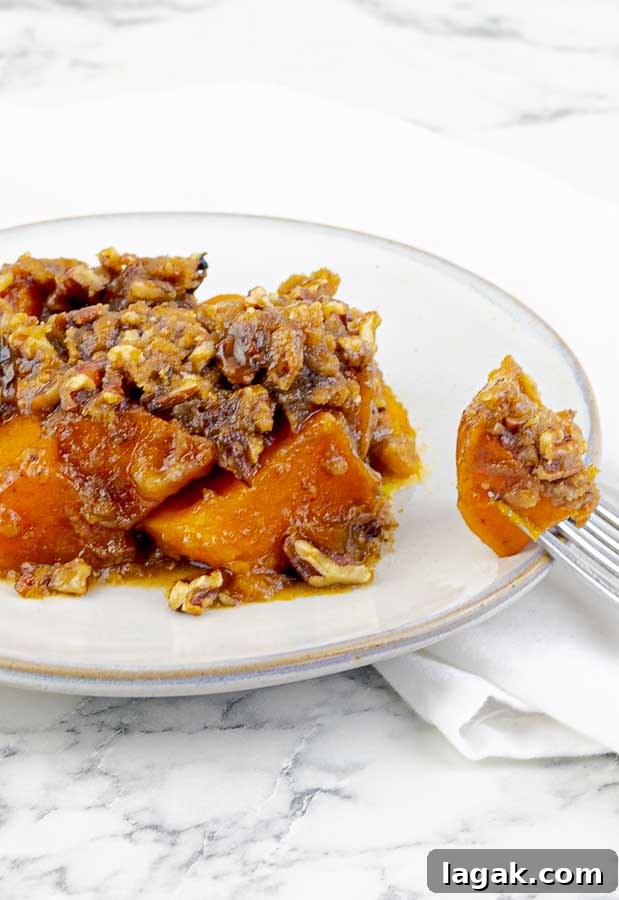 white plate of Slow Cooker Sweet Potato Casserole