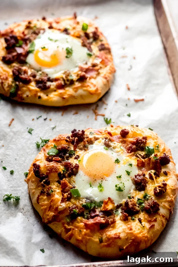 Baked breakfast pizzas on a tray. Baked breakfast pizzas on a tray.