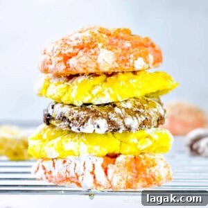 Cake Mix Cookies with Cool Whip: Soft, Fluffy No-Fuss Recipe 13 stacked cool whip cake mix cookies (lemon, chocolate, and strawberry) on a baking rack.