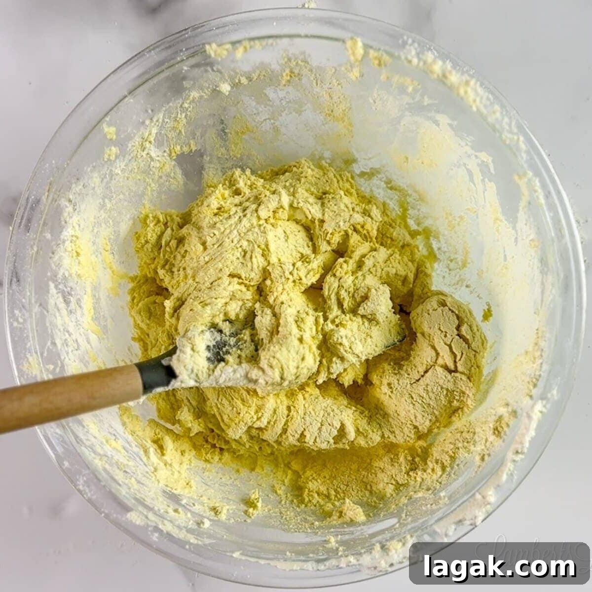Cake Mix Cookies with Cool Whip: Soft, Fluffy No-Fuss Recipe 4 yellow cookie dough in a clear glass bowl.