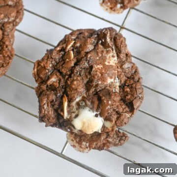 rocky road cookie on a baking rack.