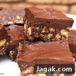 Hedgehog Cake Slice: No-Bake Chocolate & Biscuit Treat 13 Hedgehog Slice is a classic no bake, chocolate fudge-like recipe that only requires a handful of ingredients and minimal time setting in the fridge. #hedgehogslice #chocolateslice #chocolatefduge #chocolatehedgehogslice #fudgerecipe
