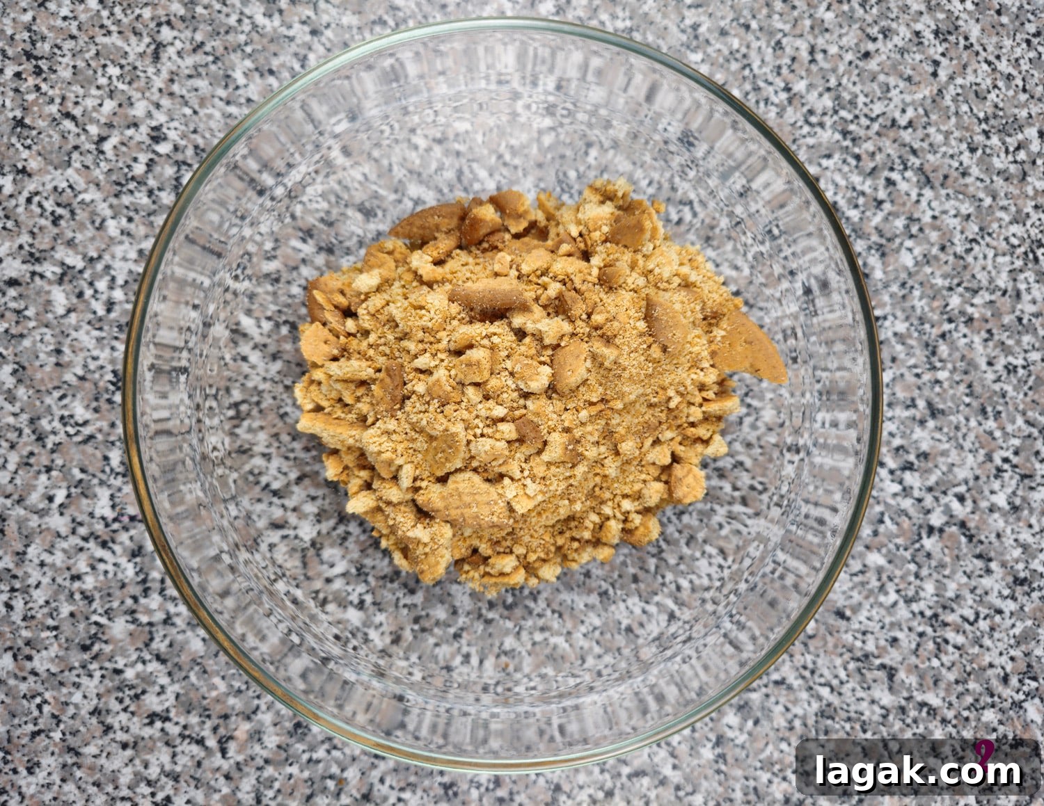 Hedgehog Cake Slice: No-Bake Chocolate & Biscuit Treat 5 Crushed digestive biscuits in a bowl.