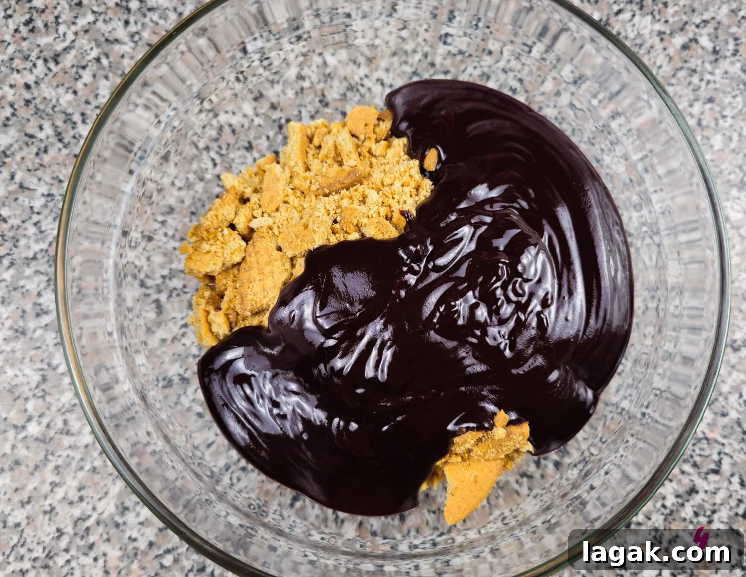 Hedgehog Cake Slice: No-Bake Chocolate & Biscuit Treat 7 Chocolate poured over crushed biscuits to make the hedgehog slice recipe.