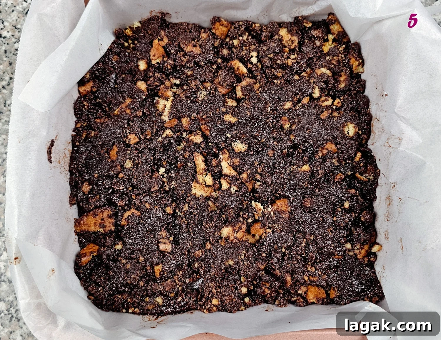 Hedgehog Cake Slice: No-Bake Chocolate & Biscuit Treat 8 Chocolate hedgehog slice in a baking pan.