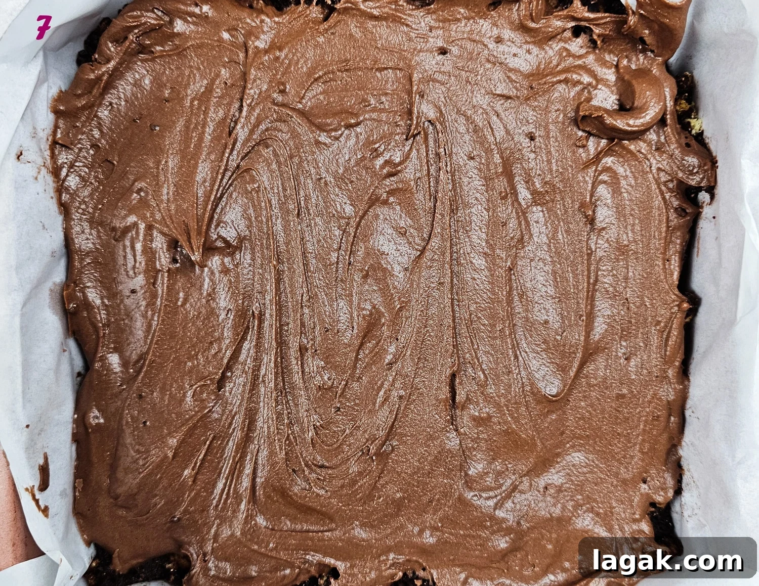 Hedgehog Cake Slice: No-Bake Chocolate & Biscuit Treat 10 Chocolate icing spread on top of the hedgehog slice recipe.